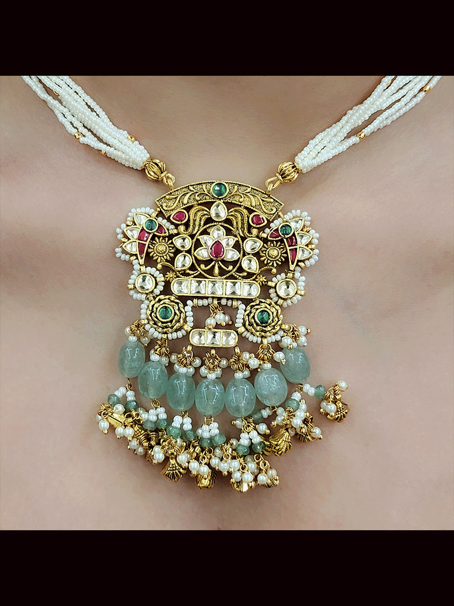 Antique gold finish 8 inch long string paachi kundan pendant set with aqua and ghunghru hangings