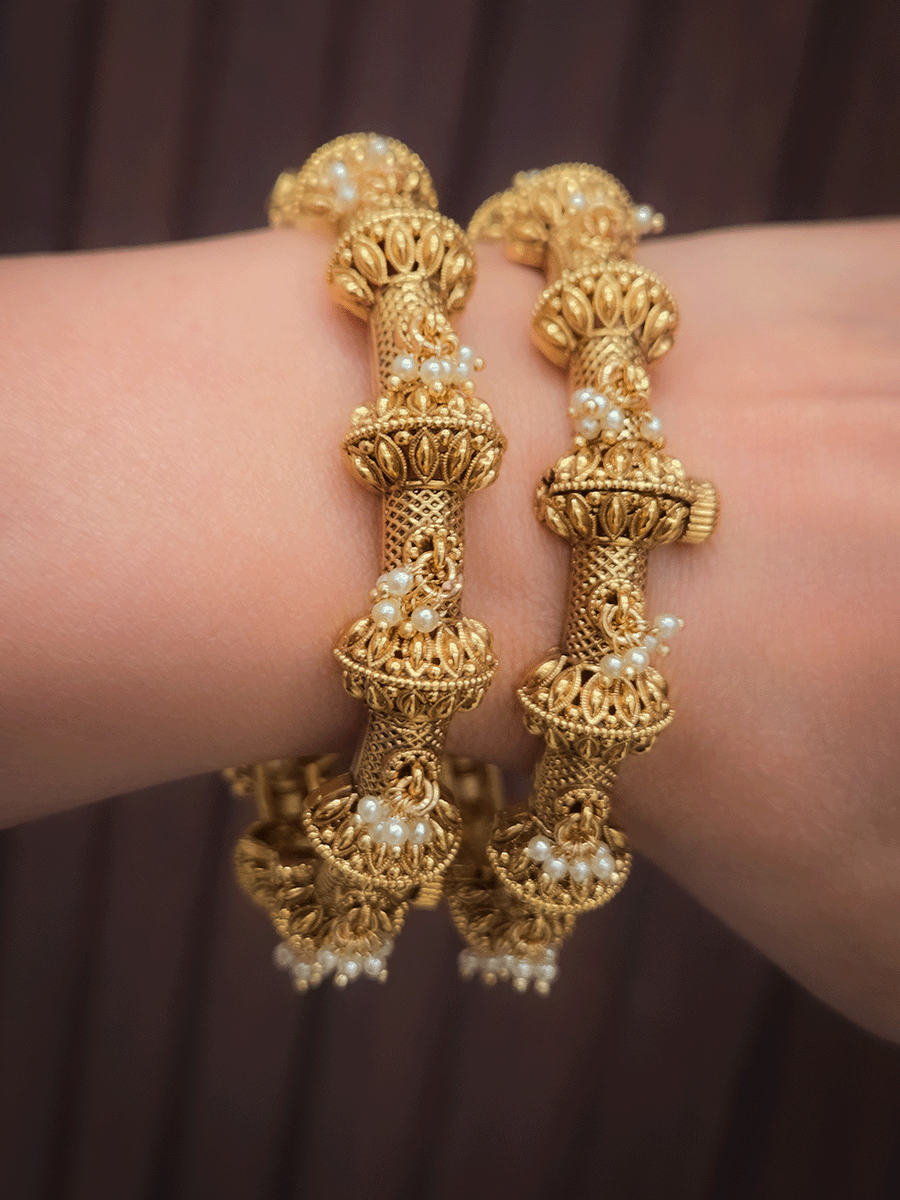 Pearly hangings in between half gold bead with leaf design openable kadas(set of two)