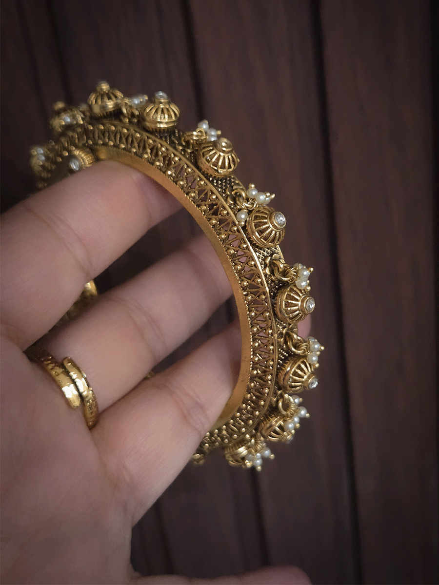 Kundan studded in wheel design set of two openable kada's with pearly hangings