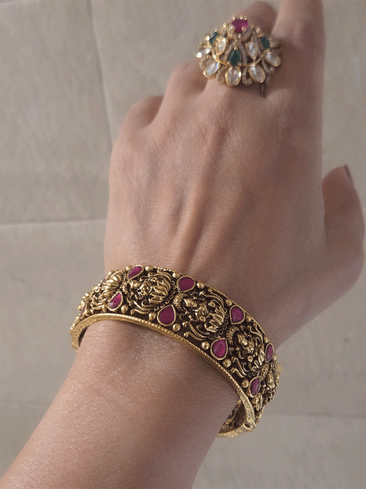 Set of two openable antique gold finish laxmiji kada's with ruby stones