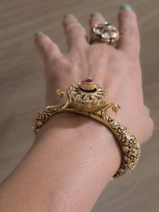 Single openable intricate carving with peacocks on sides moissanite kada with flower design in center