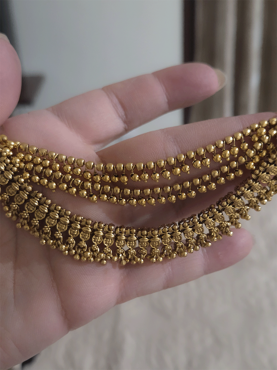 Three layers with bead hangings and circular self design ear chains