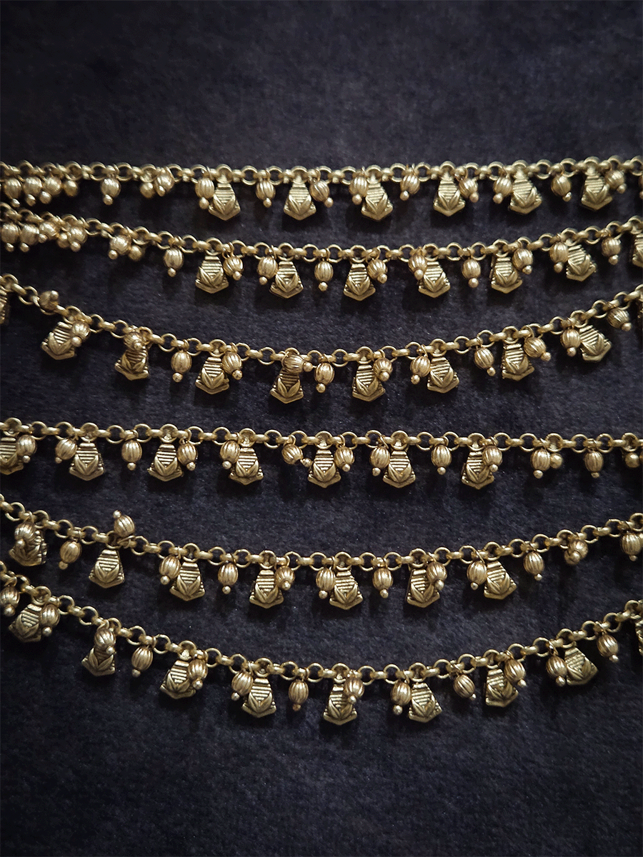 Golden tukdi with self leaf design and bead hanging three layer ear chains