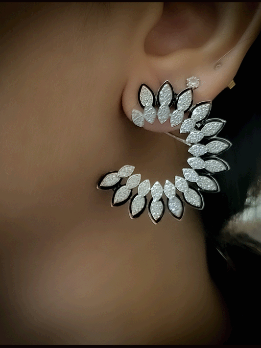 Black enamel leaf design zircon studded half moon shaped earrings