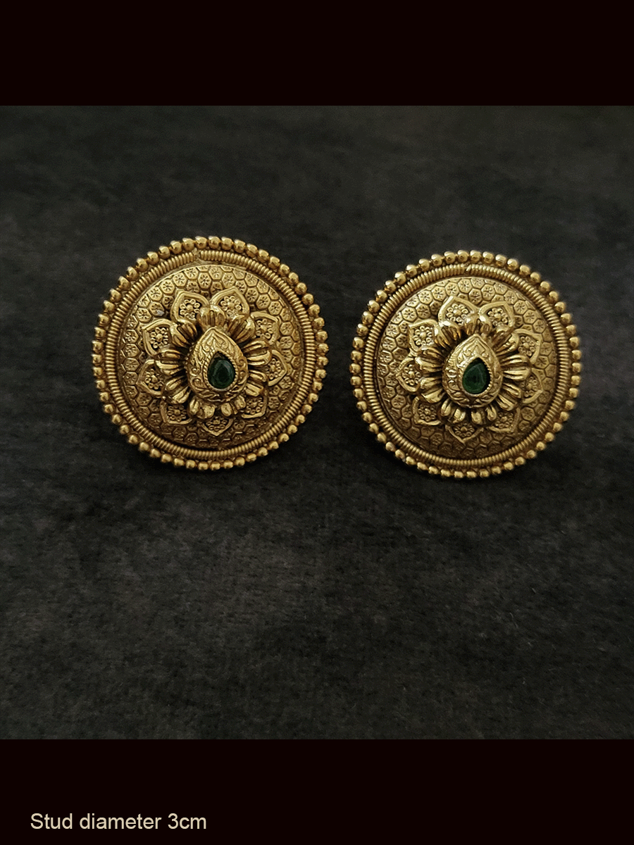 Round 3cm diametrer bold studs with tear drop shaped ruby stone on flower design