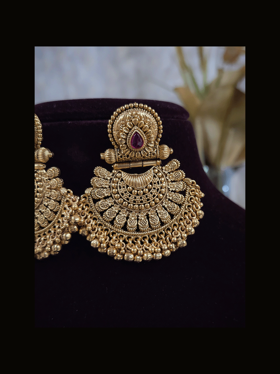 Tear drop ruby stone circular top earrings with half flower design bottom with ghunghru hangings