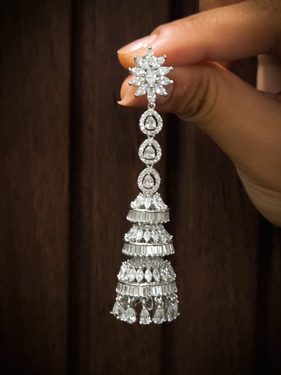 Silver finish triple layer AD jhoomki earrings with three tear drop white stones top(8cm long)