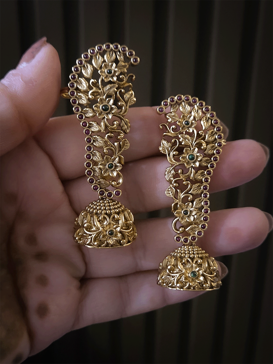 Traditional flowers design with ruby and green stones studded earcuffs