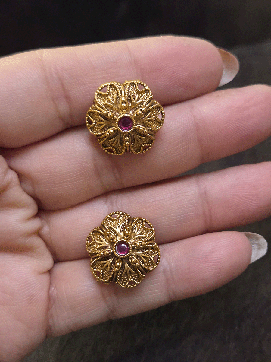 Flower design 2cm broad studs with ruby stone in center