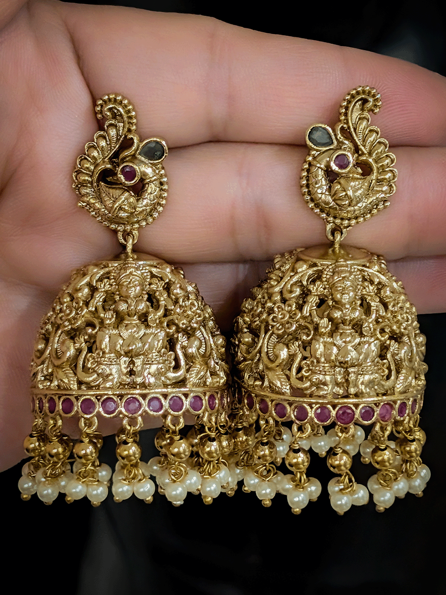 Ruby and green stones studded 7cm long laxmiji domb jhoomki with peacock top design