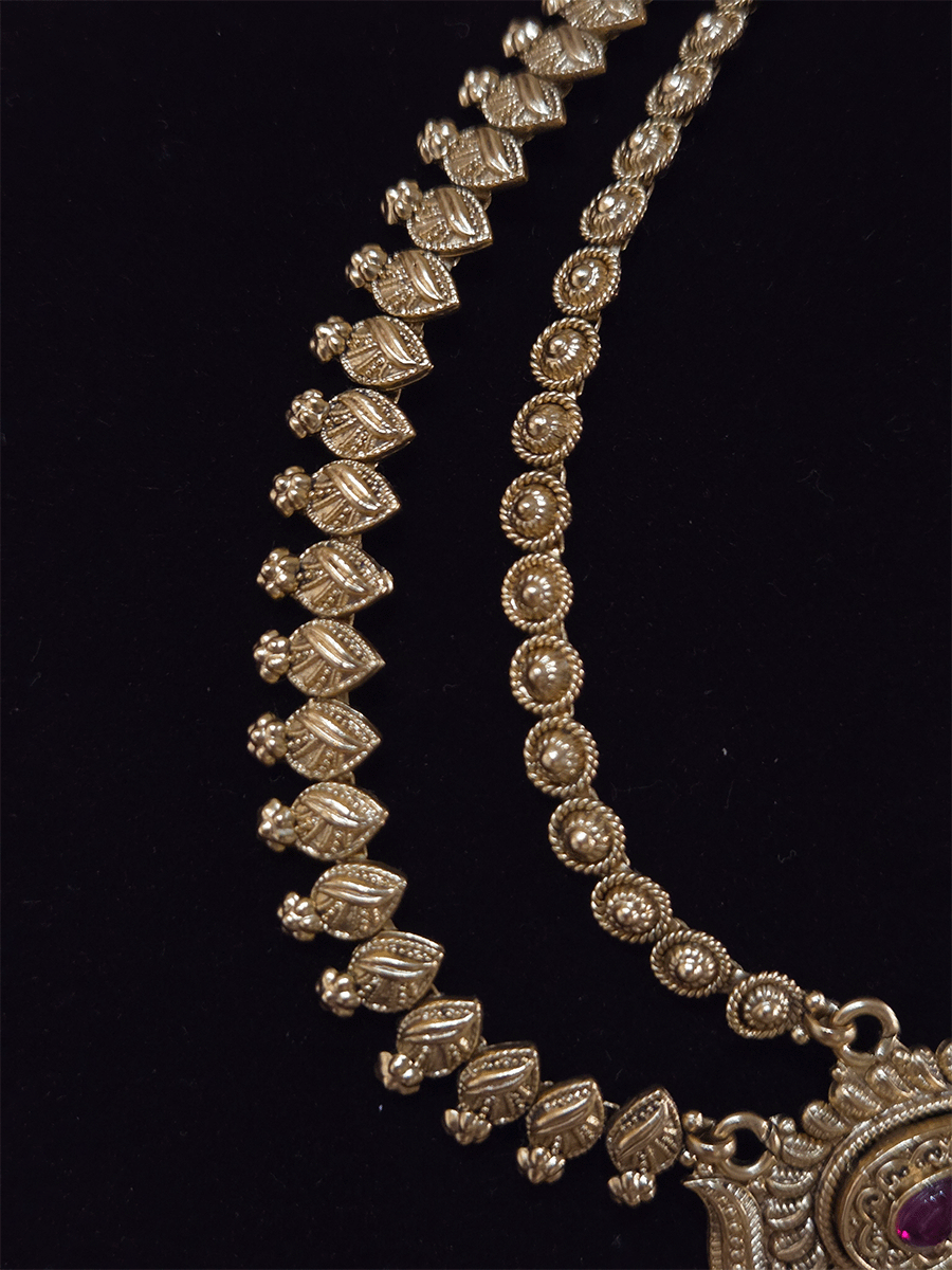 Peacock on both sides of half flower with tear drop ruby stone top two chains mathapatti