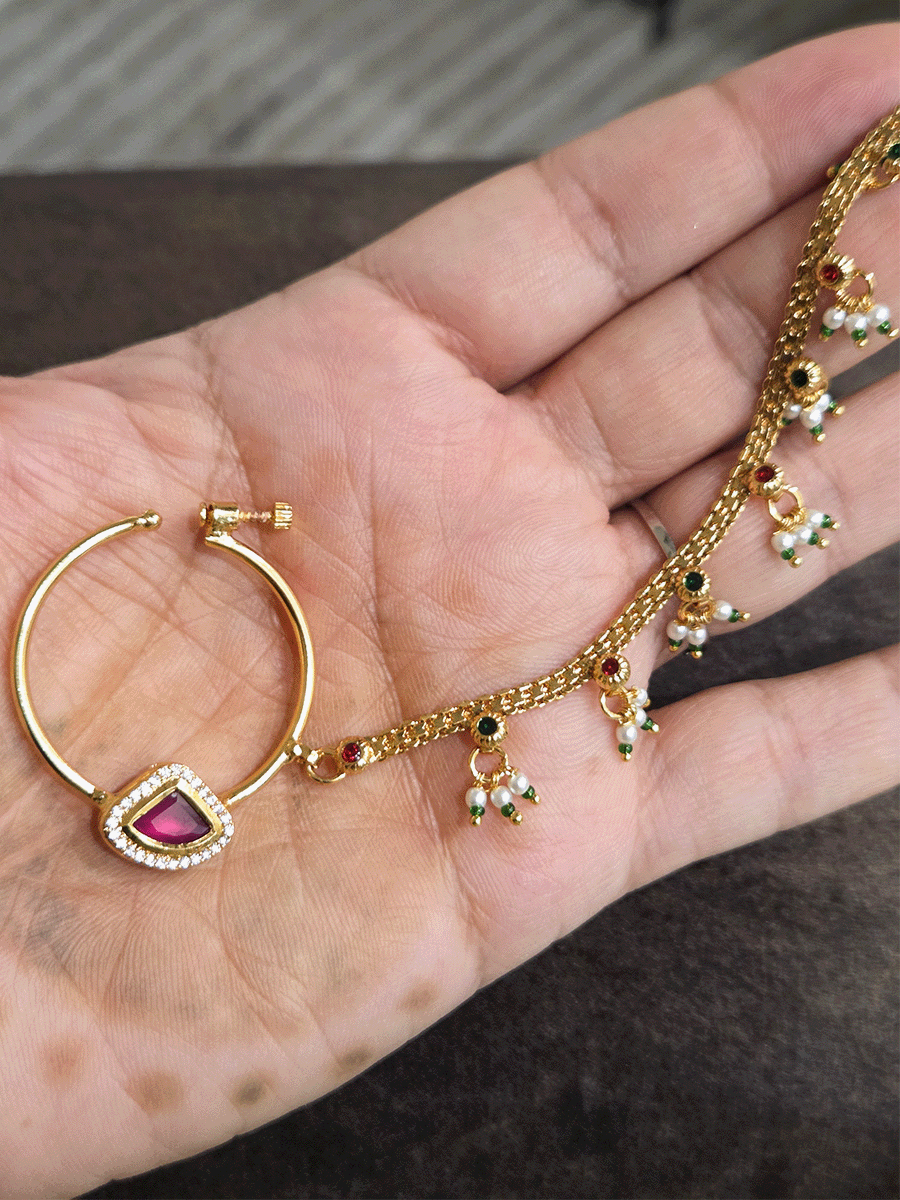 Triangular ruby stone with AD outline 3cm diameter nath