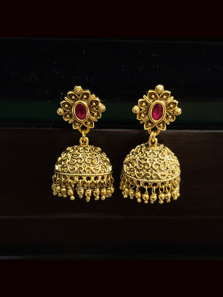 Ruby and green stones studded pendant set in gold bead chain