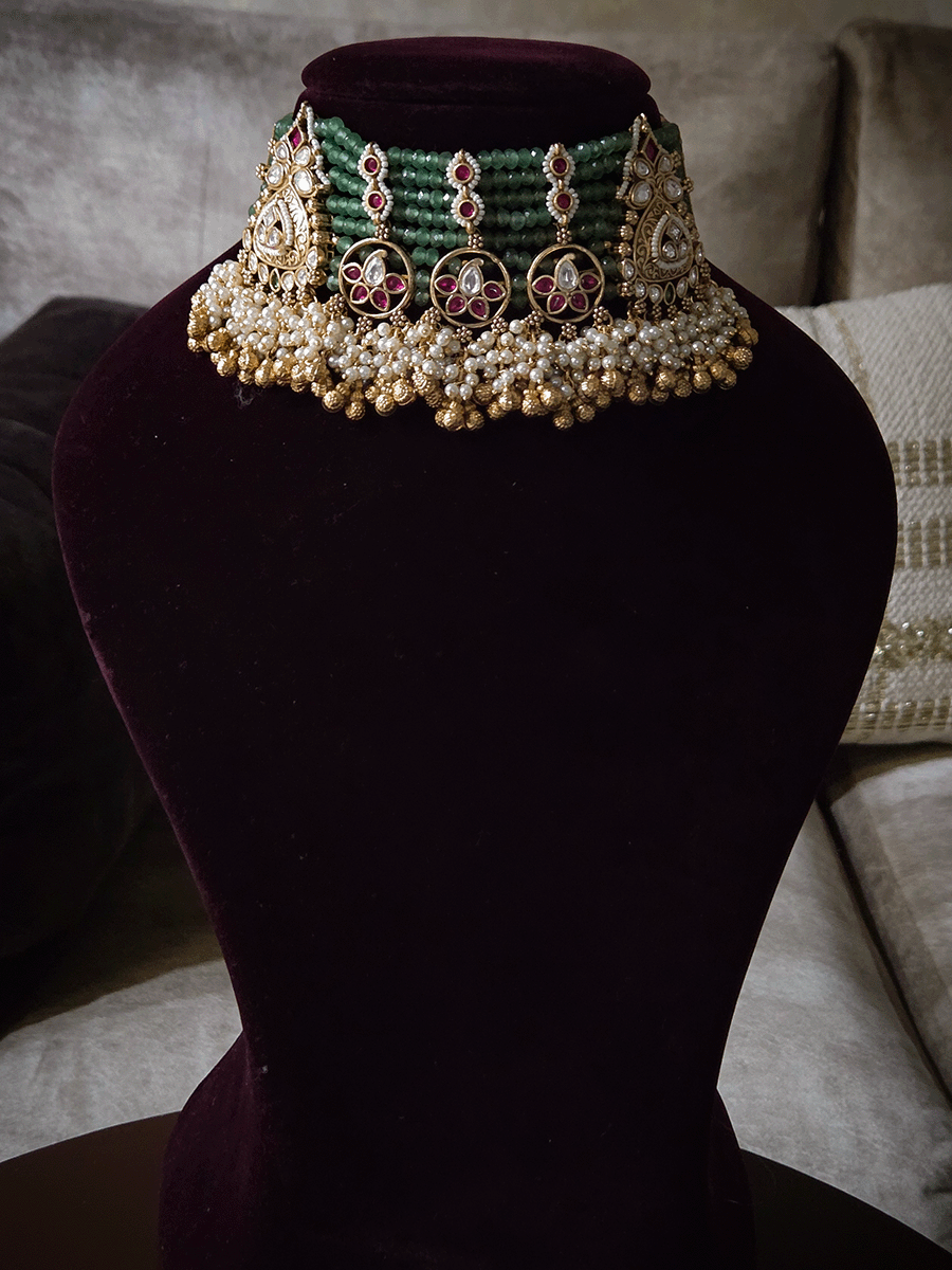 Traditional design kundan tukdies in eight aqua bead strings set