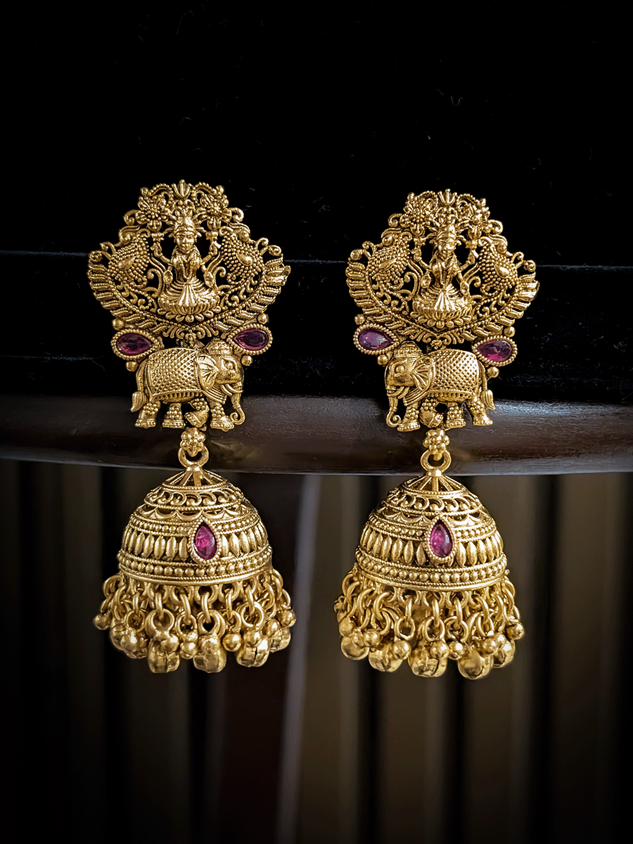 Classy laxmiji motif in center broad choker set with ruby stones and peacock design