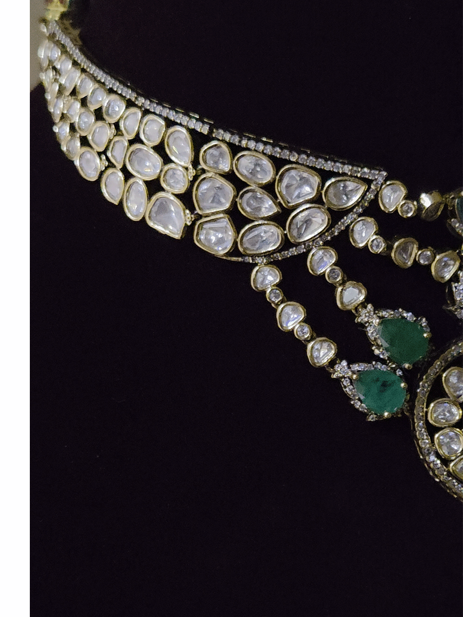 Moissanite set with connecting moissanite tukdies with green tear drop stones set