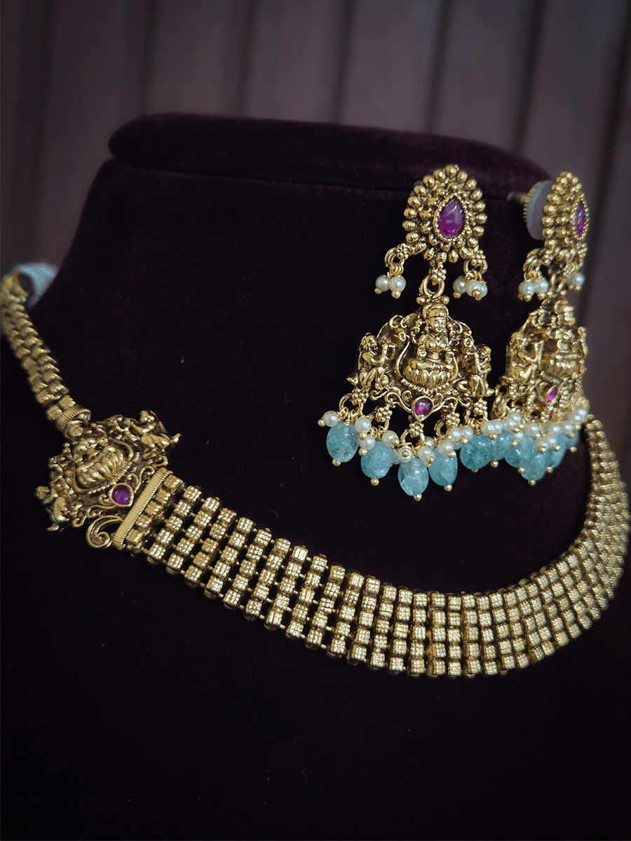 Broad chain with laxmiji side brooches set with laxmiji motif earrings
