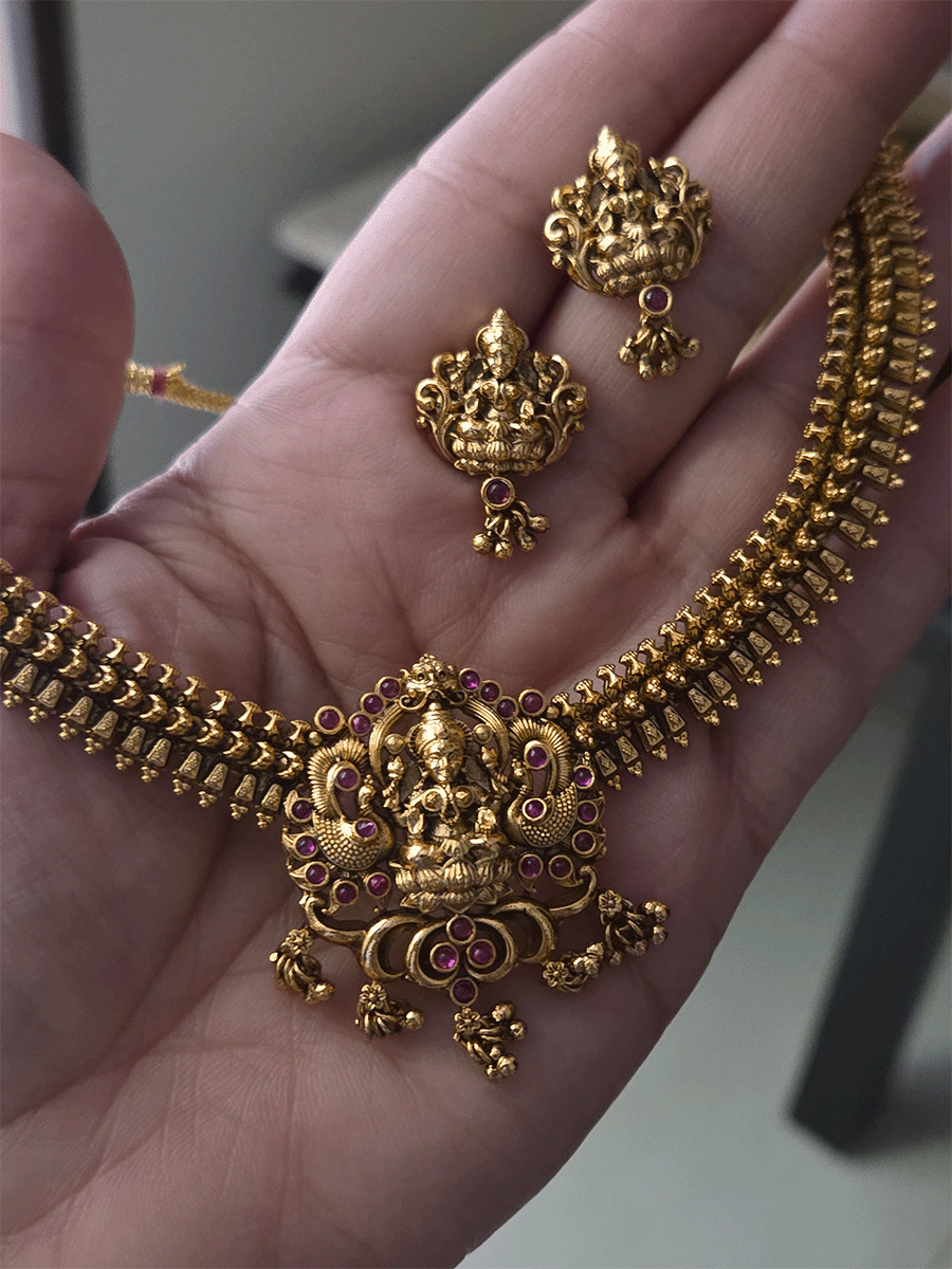 Ruby stones studded laxmiji motif set with side classy design chain