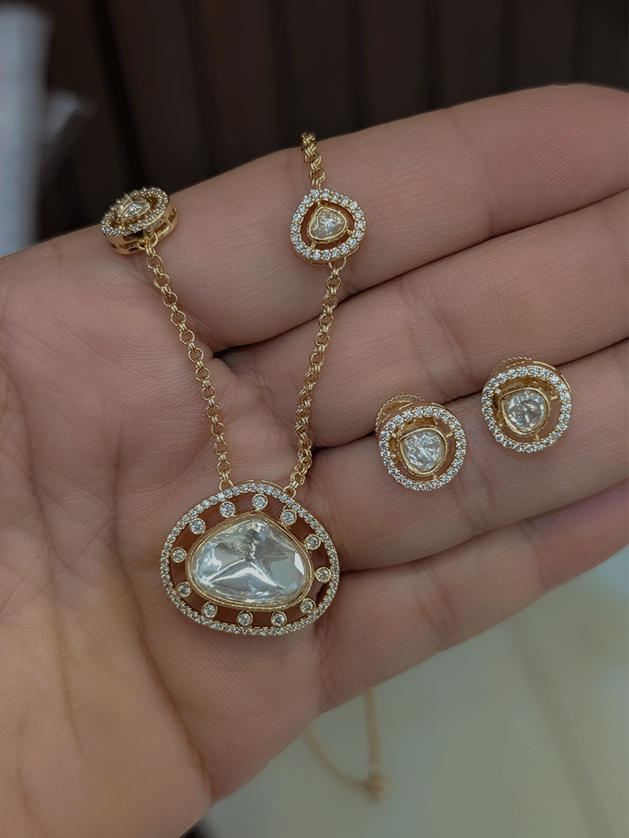 Triangular moissanite and AD pendant set in 9 inch long chain with four triangular tukdies