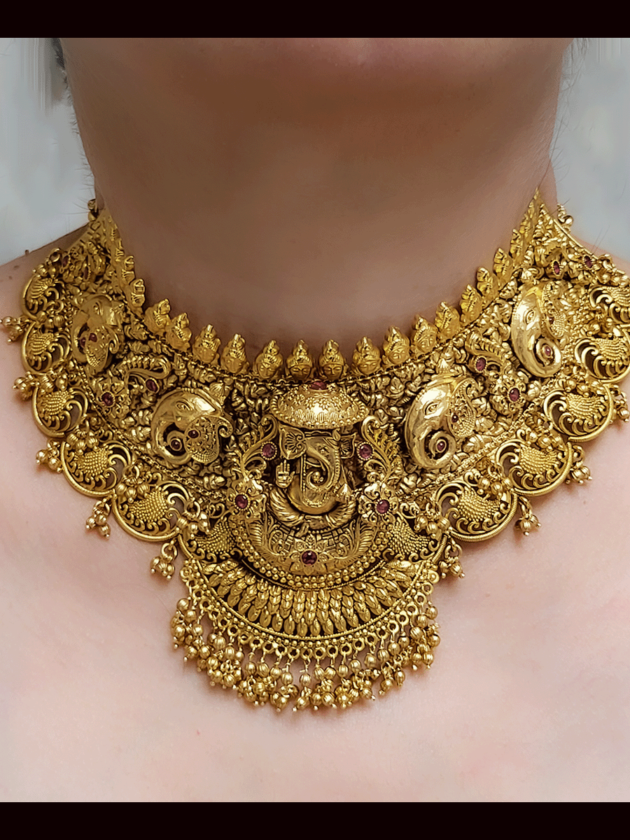 Ganpatiji motif center broad choker set with peacock design and hanging bead detailing
