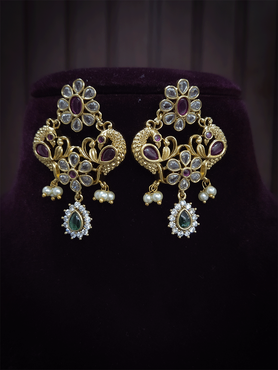 Polki,ruby and green stones studded flower and leaf tukdi tassel drops choker set