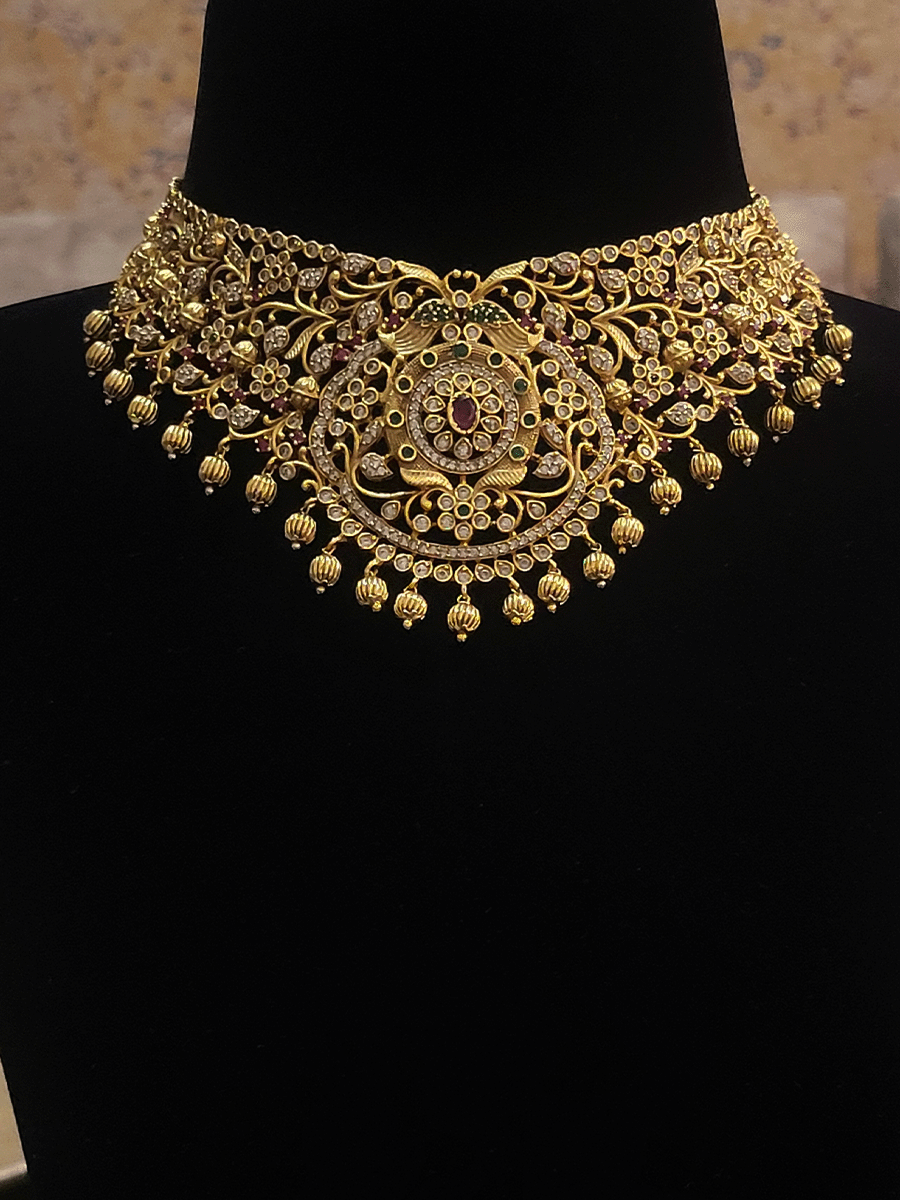 Ruby,polki and green stones studded peacock motif's intricate design set