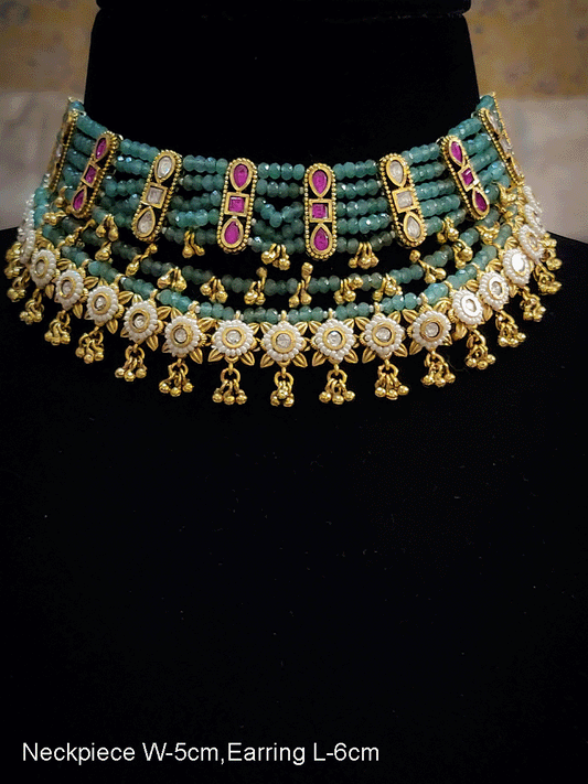 Multiple aqua strings set with ruby and kundan and white tukdies with ghunghru hangings
