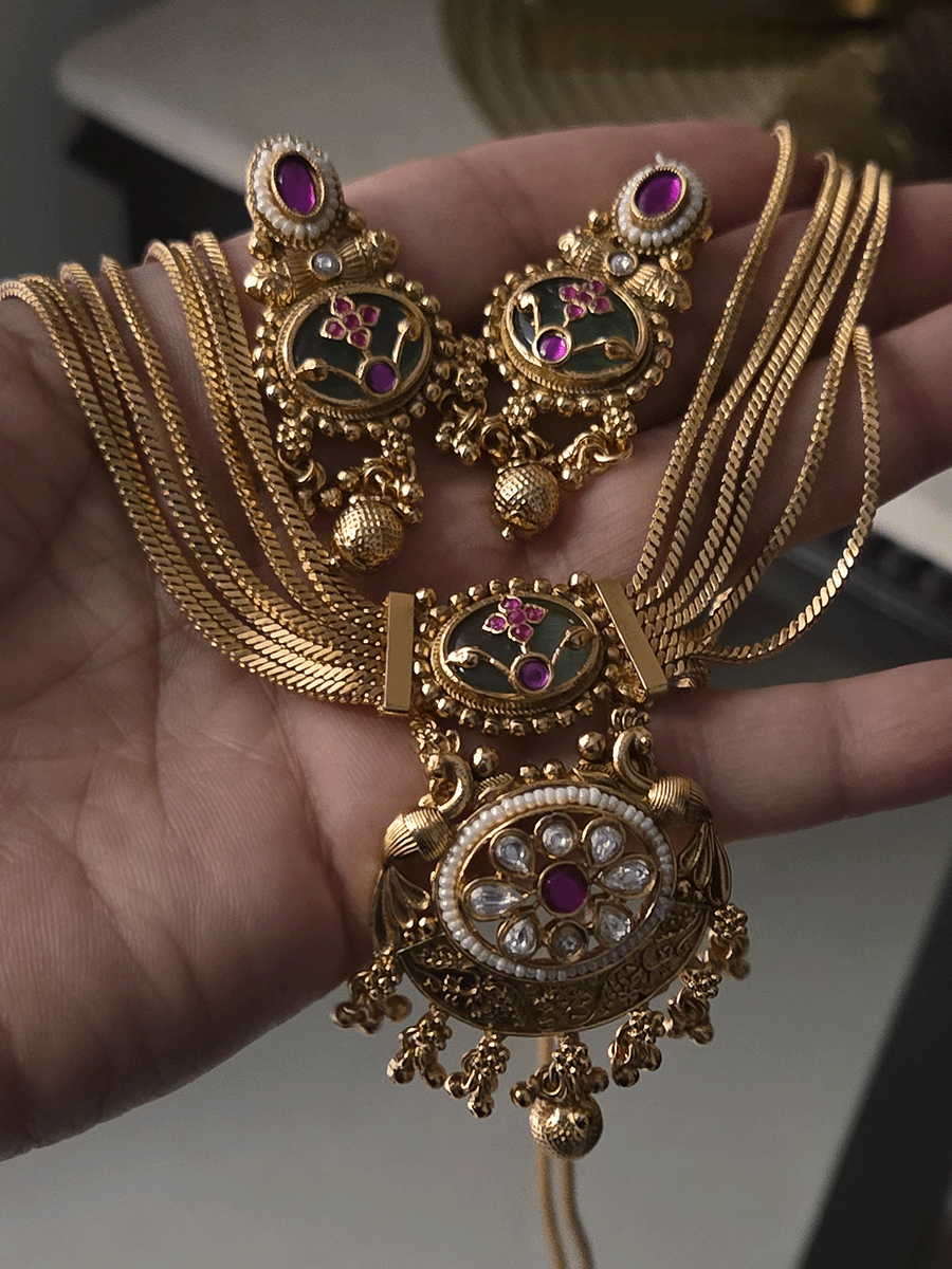 Seven layer gold chain set with kundan flower center pendant and aqua stone with inlay work on top