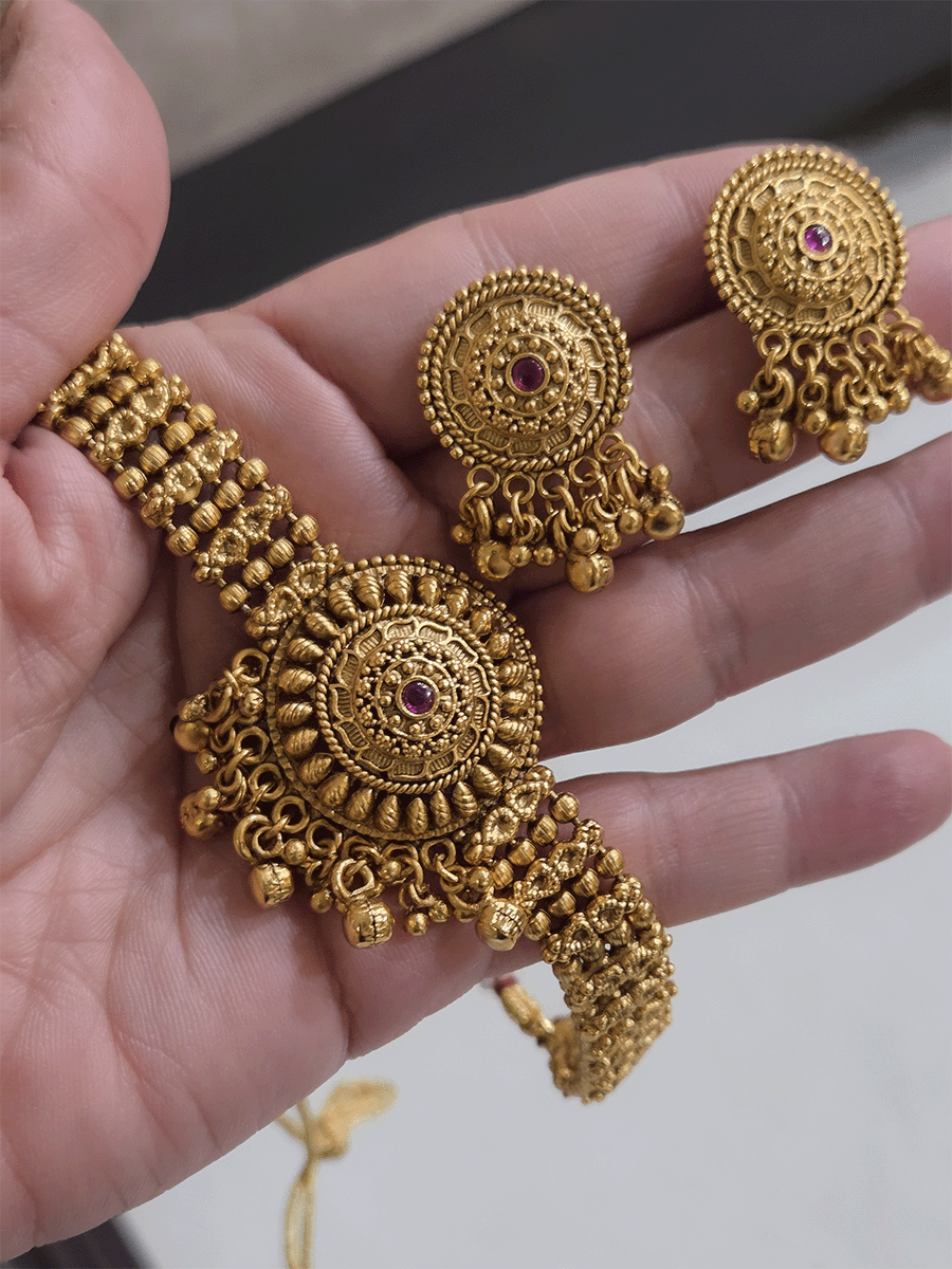 Circular flower center with ruby stone chik set with broad chain