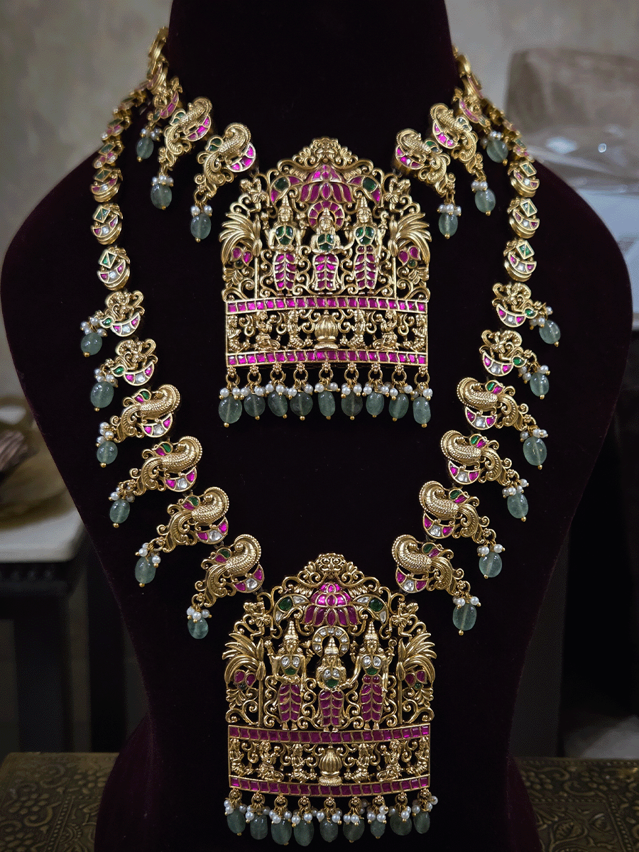 Pink and green stones studded 10" long string Ram durbar with peacock side string aqua bead drops paachi kundan set