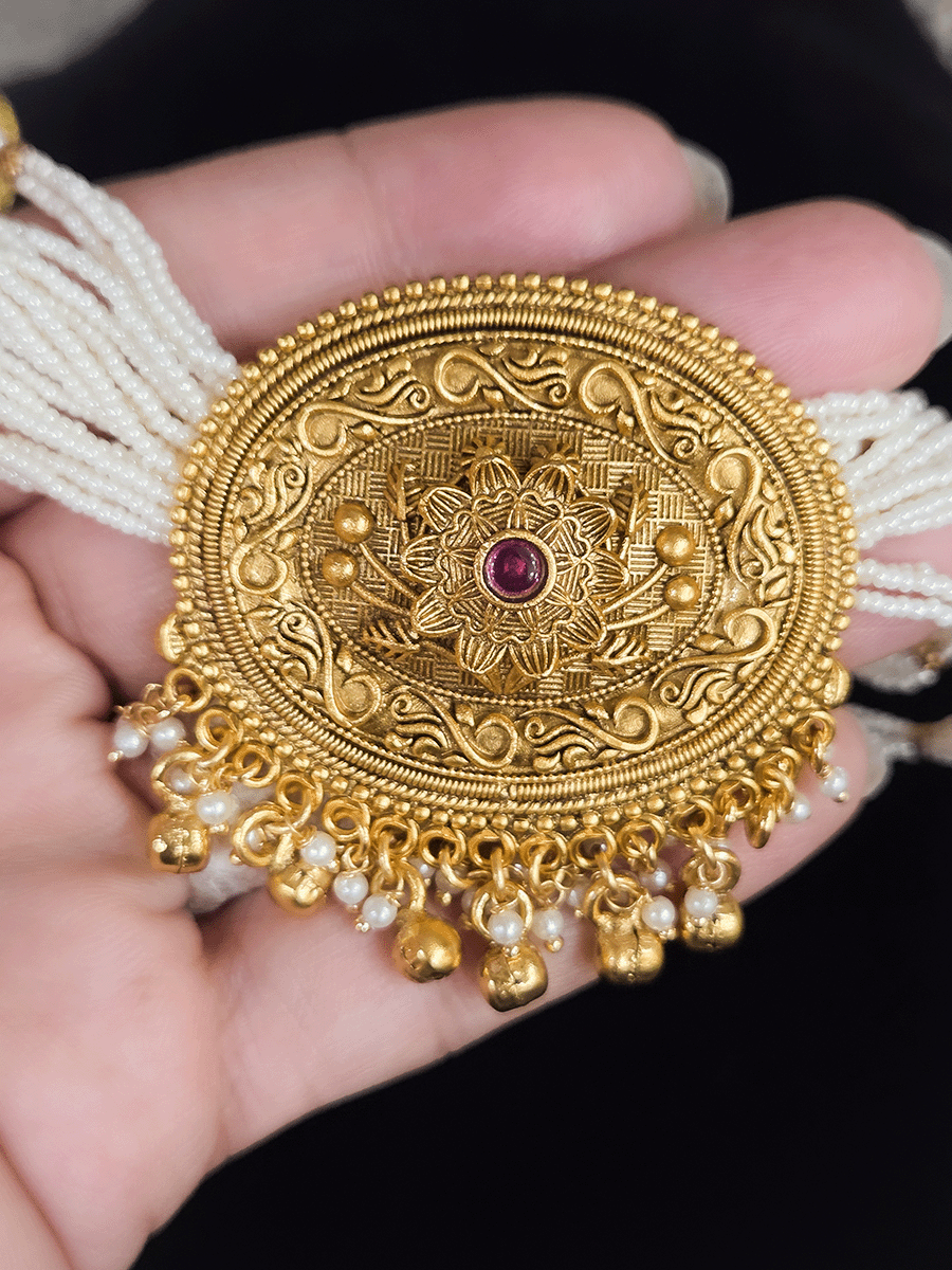 Oval center pendant with ruby stone on flower design side cheed string set