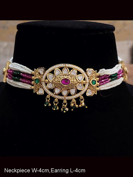 Oval kundan tukdi with ruby stone center set with side cheed strings