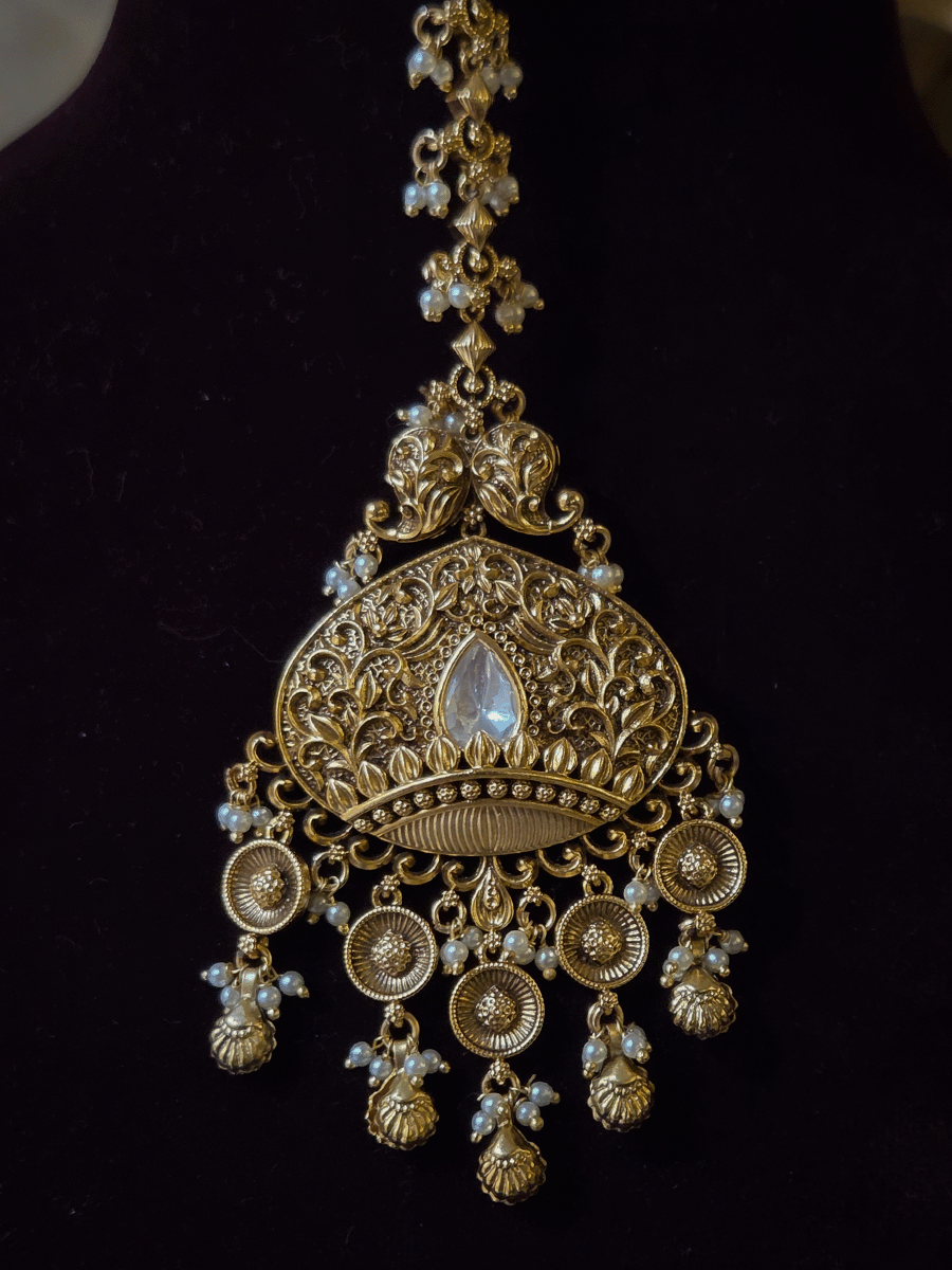 Intricately carved 12cm broad paisley design kundan set with coloured drops and ruby stone leaf design center