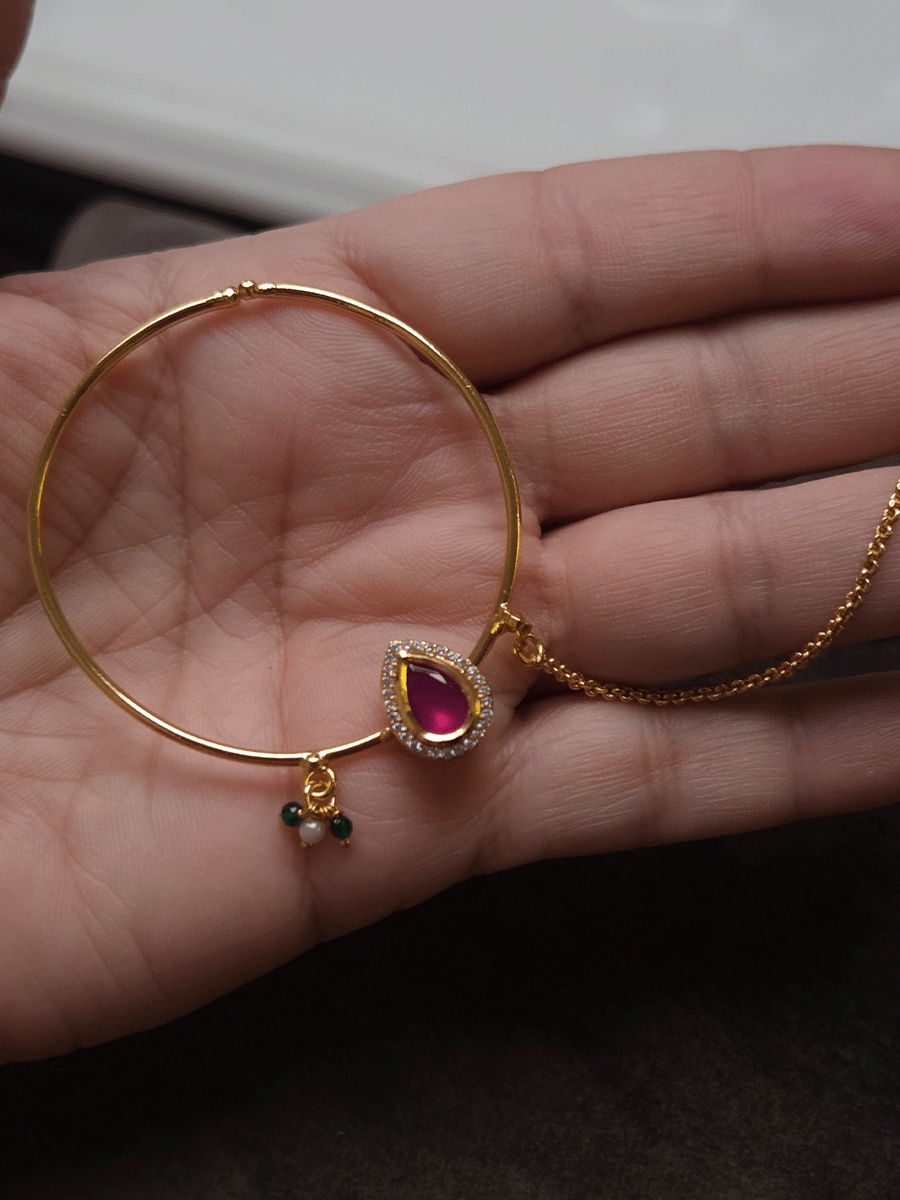 Tear drop ruby stone with zircon detailing gold ring 5cm diameter nath with bead hangings