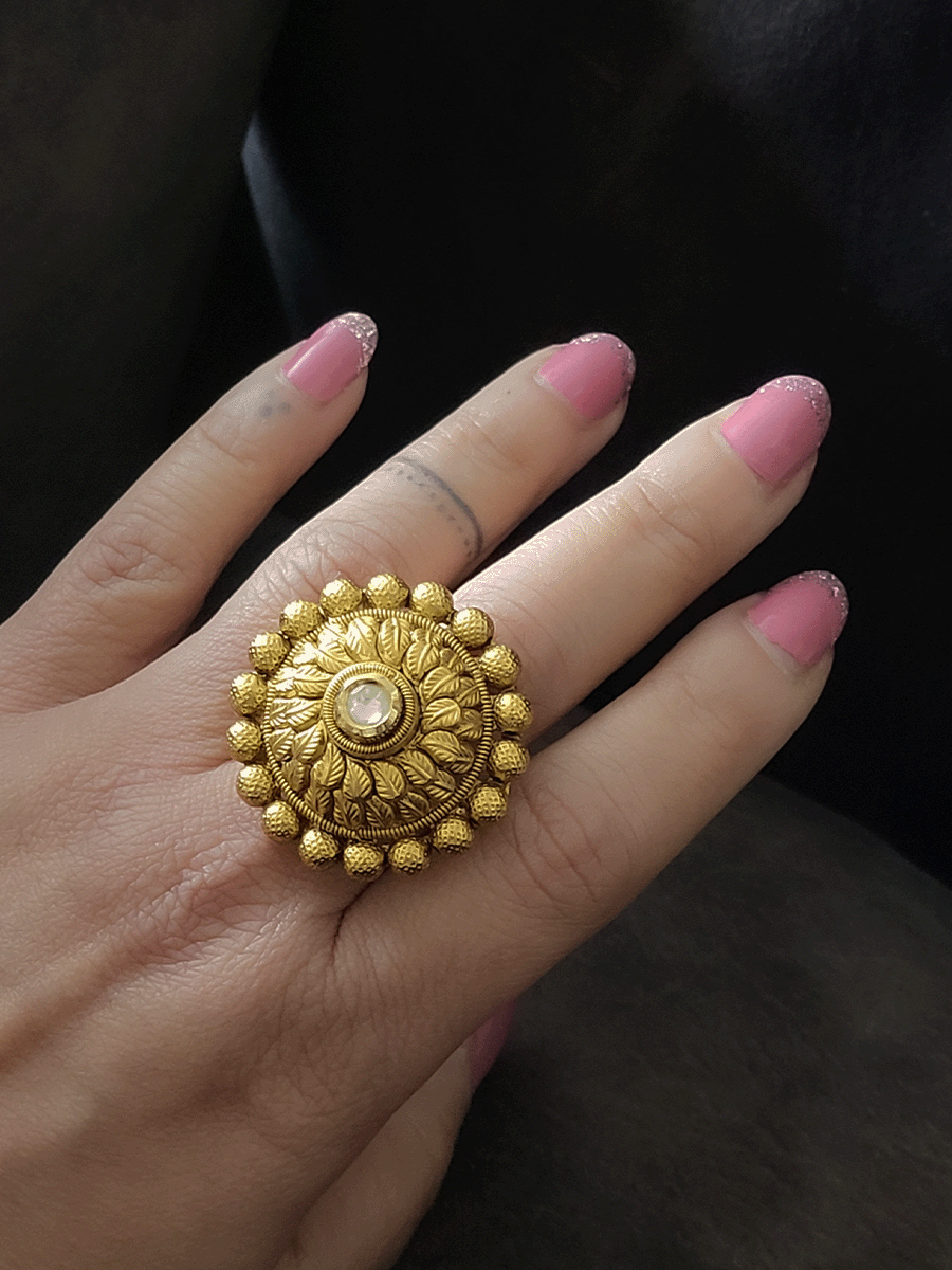 Round adjustable ring with gold bead lace and leaf design around the stone