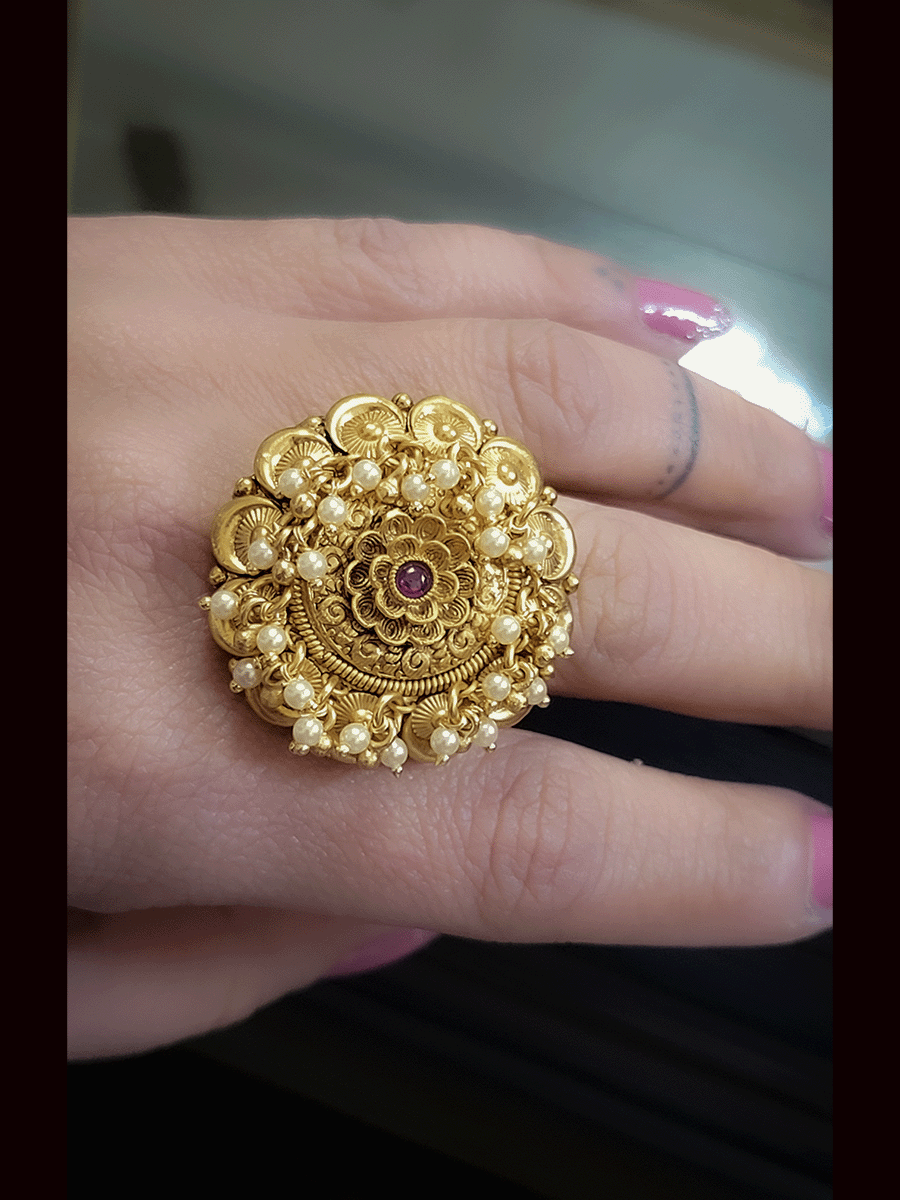 Flower center with ruby stone openable ring with pearly hangings