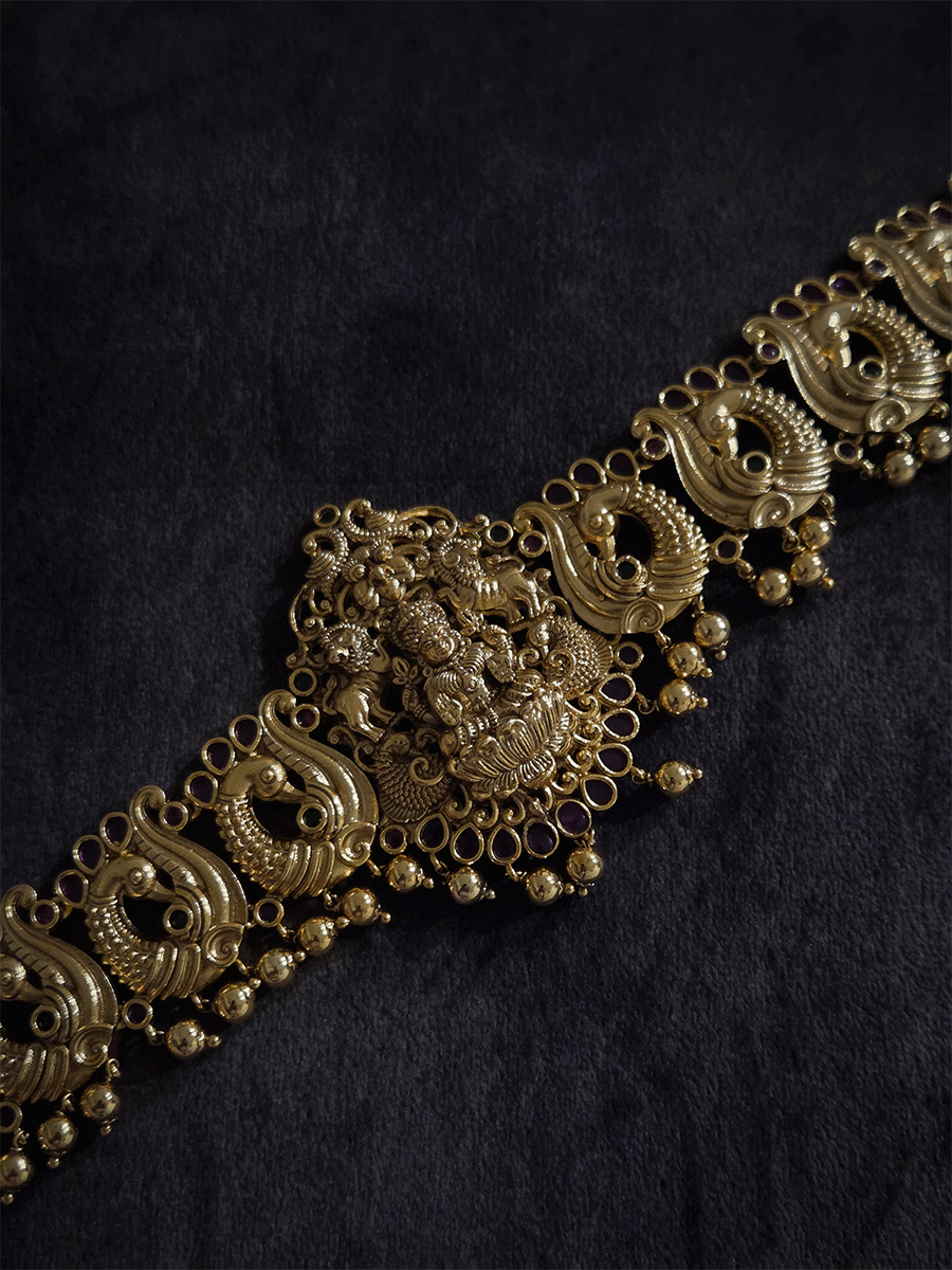 Laxmiji motif in center on peacock side design waist belt with gold bead hangings