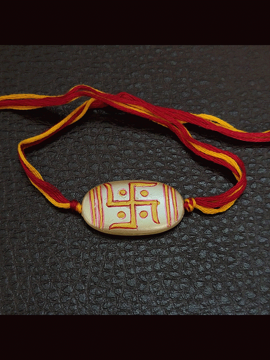 Hand painted swastik design white oval bead rakhi(approx.1inches bead)