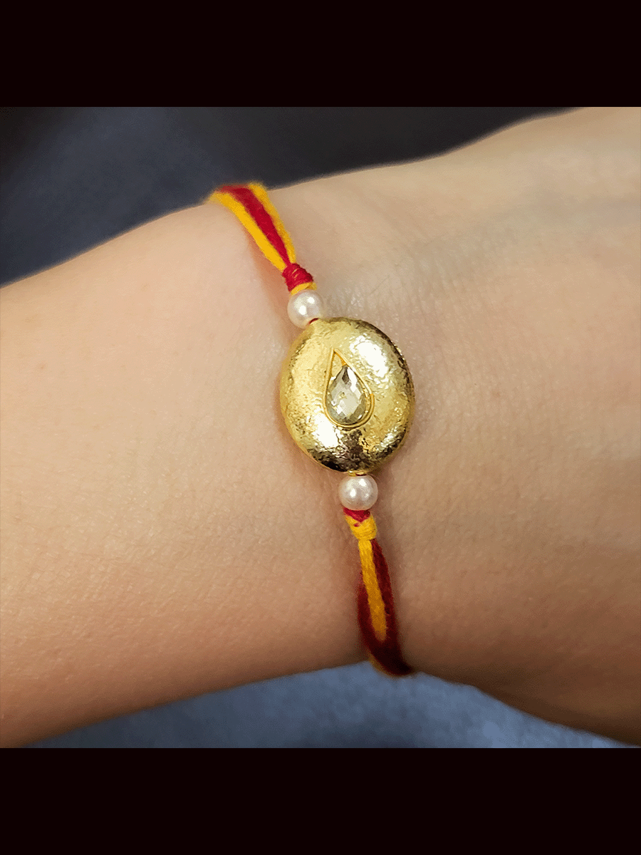 Set of three coloured thread gold bead rakhi's with kundan in the center(Set of 3 rakhi's)