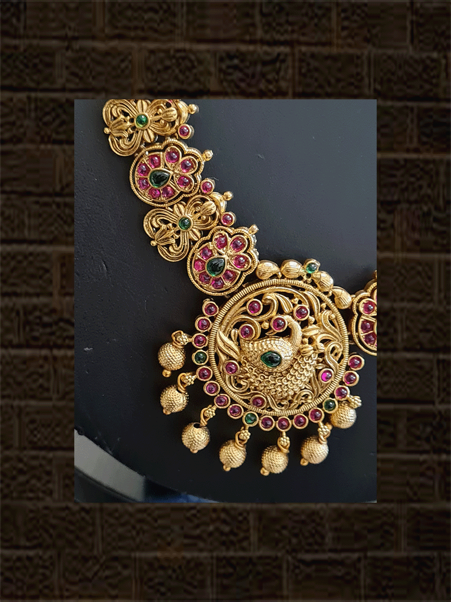 Traditional peacock design long pendant set with ruby and green stones and classy side string - Odara Jewellery