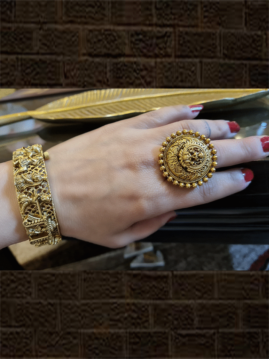 Round gold finish self design laxmiji motif ring