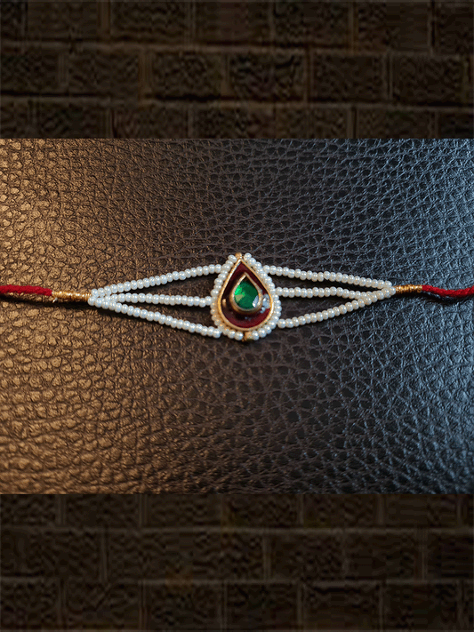 Leaf design enamel work green stone rakhi with pirohi and three cheed string dori - Odara Jewellery