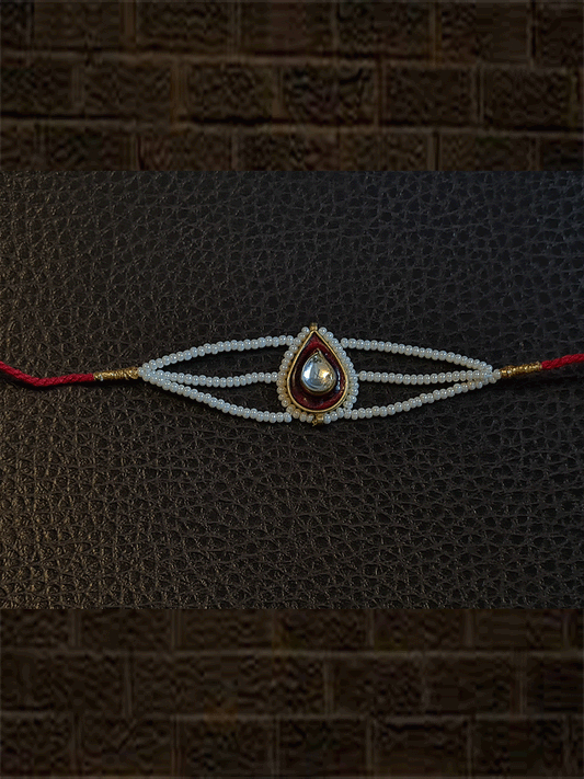 Leaf design enamel work Kundan rakhi with pirohi and three cheed string dori - Odara Jewellery