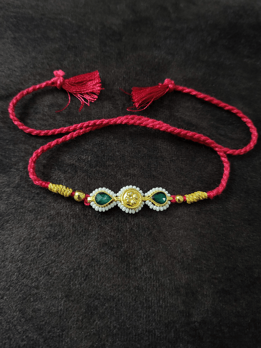 Two green leaf stones with pirohi work and antique tukdi rakhi in red thread - Odara Jewellery
