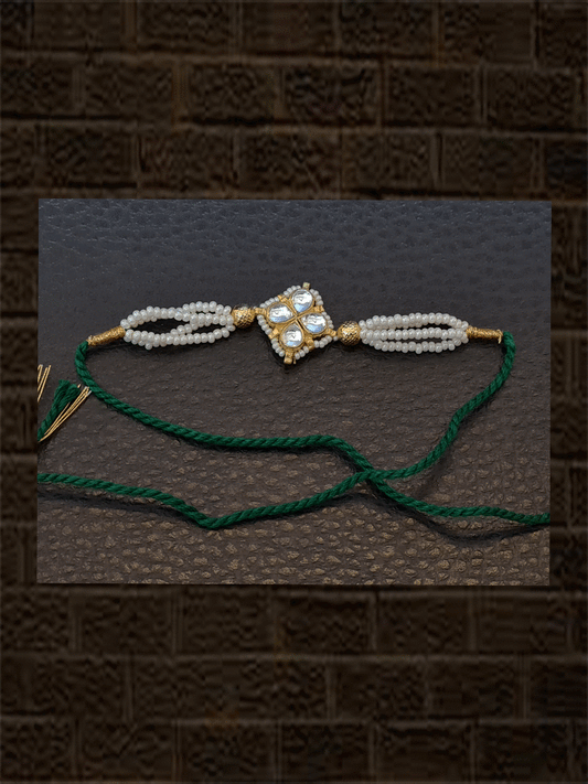 Kundan flower with pirohi work and side three cheed strings rakhi - Odara Jewellery