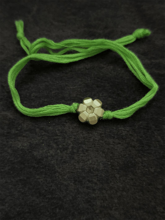 Small gold flower bead in thread rakhi - Odara Jewellery