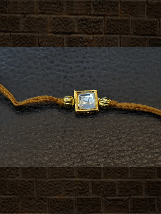 Brown thread square kundan rakhi with golden beads - Odara Jewellery