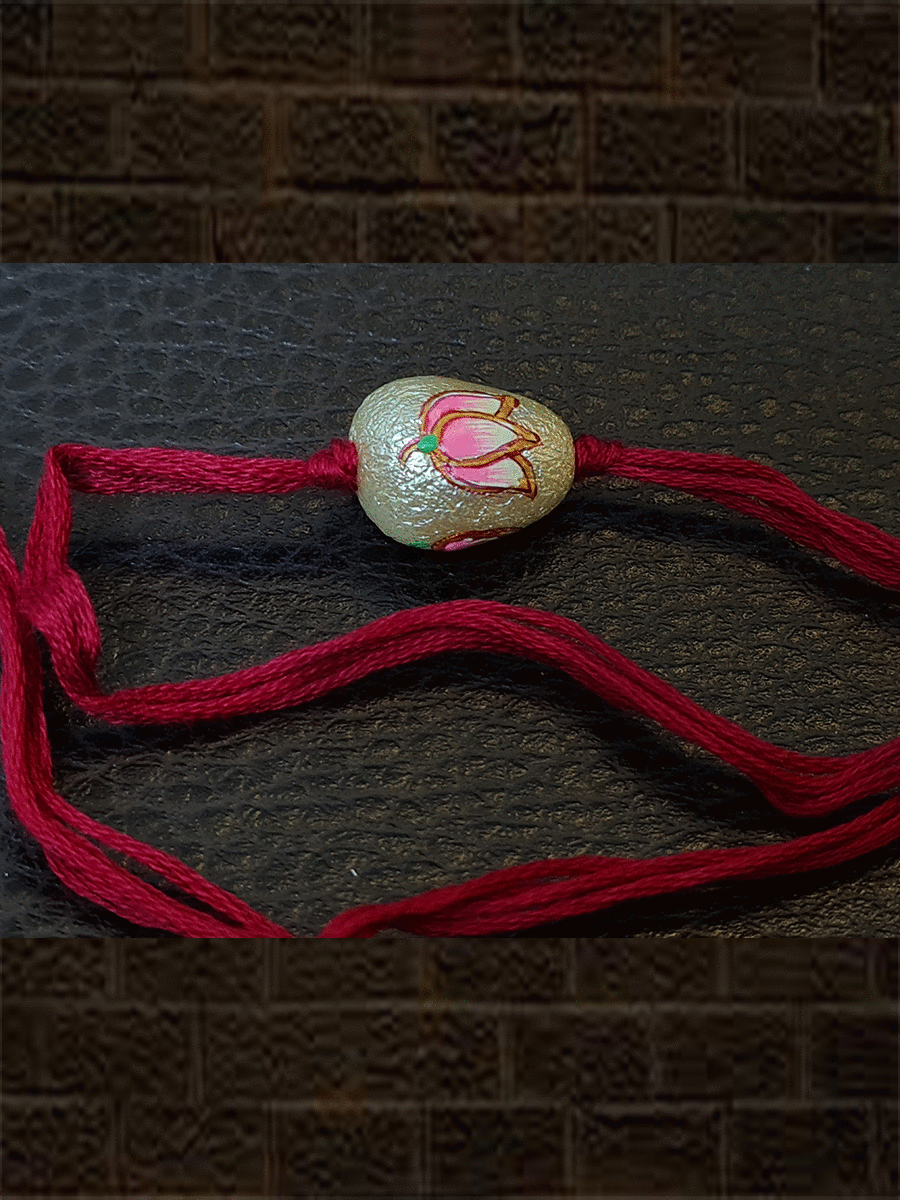 Red thread white bead hand painted pink flower rakhi - Odara Jewellery