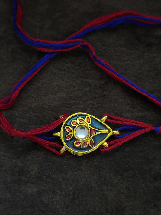 Red and blue enamel leaf shaped rakhi - Odara Jewellery