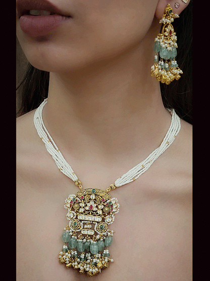 Antique gold finish 8 inch long string paachi kundan pendant set with aqua and ghunghru hangings